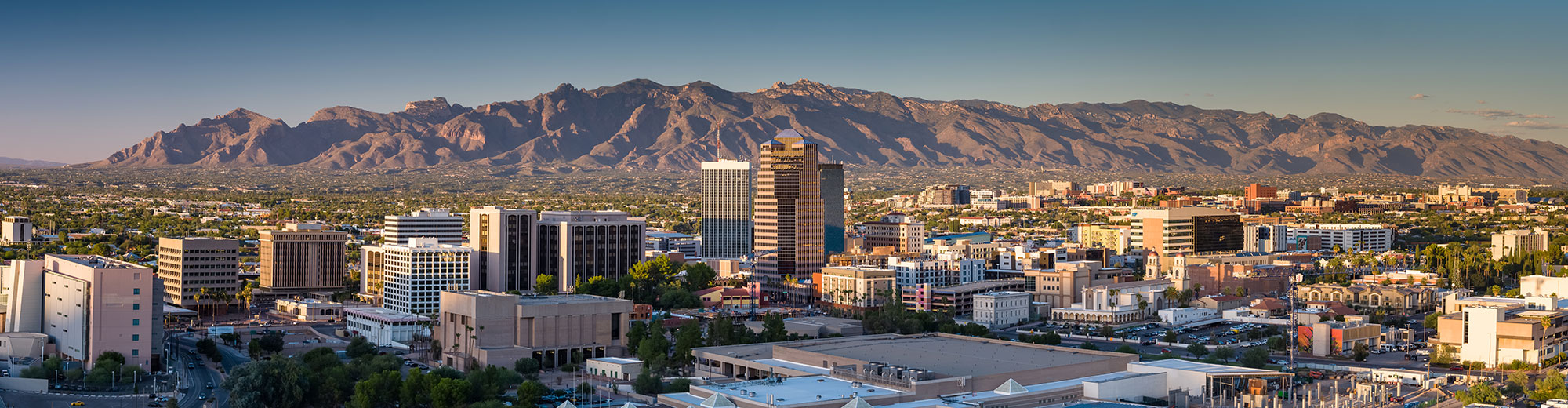 Skyline of Tucson, Arizona with downtown and mountains in background